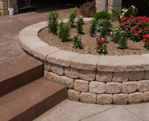 kansas patio with fire pit and retaining wall