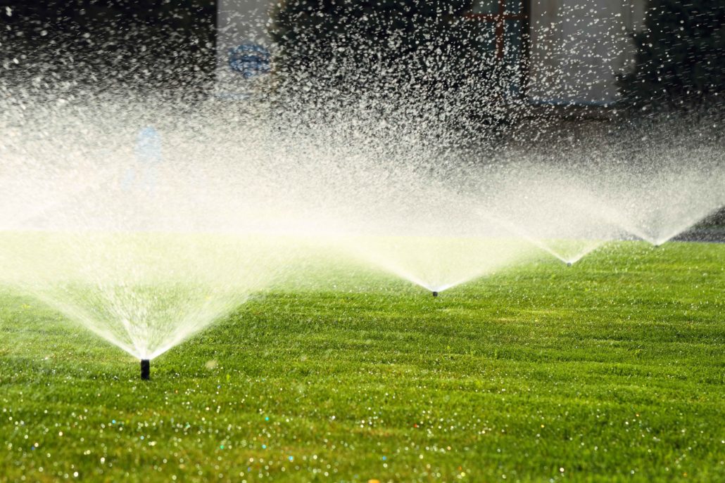 irrigation system sprinkler system watering a lawn