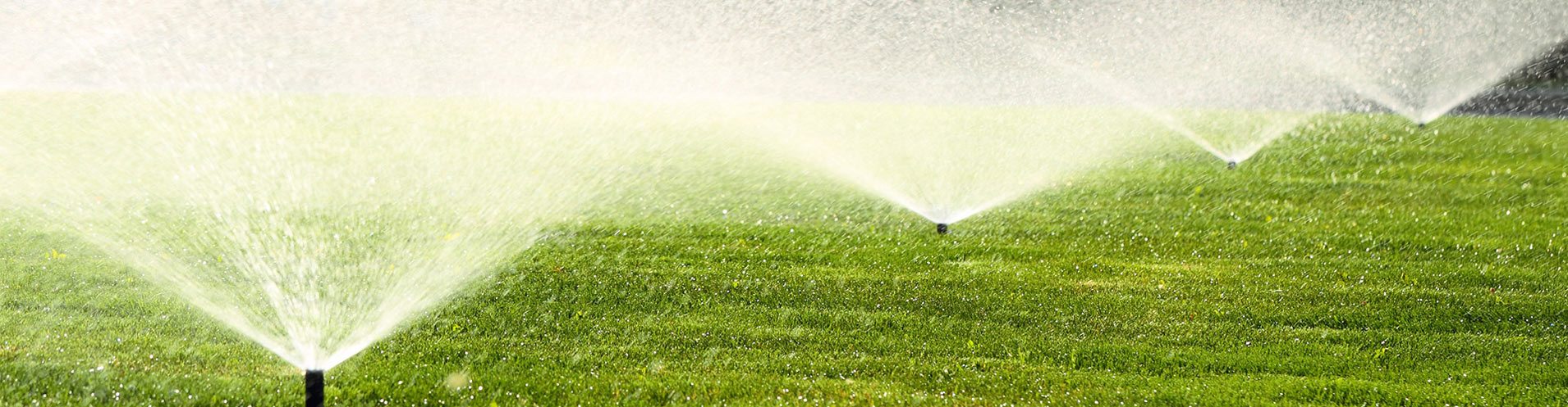 lawn care in topeka, KS lawn care services with a sprinkler