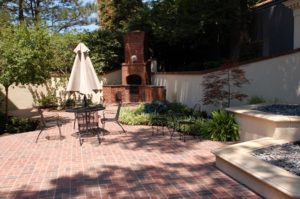 Outdoor Patio with Privacy Wall & Fireplace in Topeka